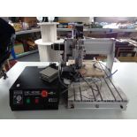 A CNC 4030Z desktop CNC engraving machine with control unit and accessories.