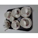 A tray containing six Duchess bone china trios together with an antique china teapot.