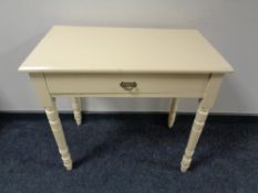 An early 20th century painted side table fitted a drawer