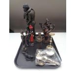 A tray of plated cutlery, silver and enamelled box, carved wooden figures,