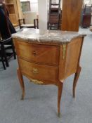 A French inlaid shaped two drawer chest with brass mounts and marble top,