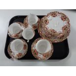 A tray containing 31 pieces of antique English floral patterned tea china.