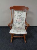 A beech spindle backed rocking chair
