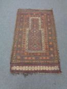 An Afghan prayer rug,