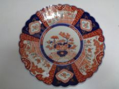 A 19th century Japanese Imari scalloped edged plate.
