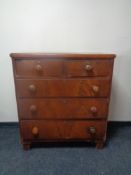 A Victorian mahogany five drawer chest.