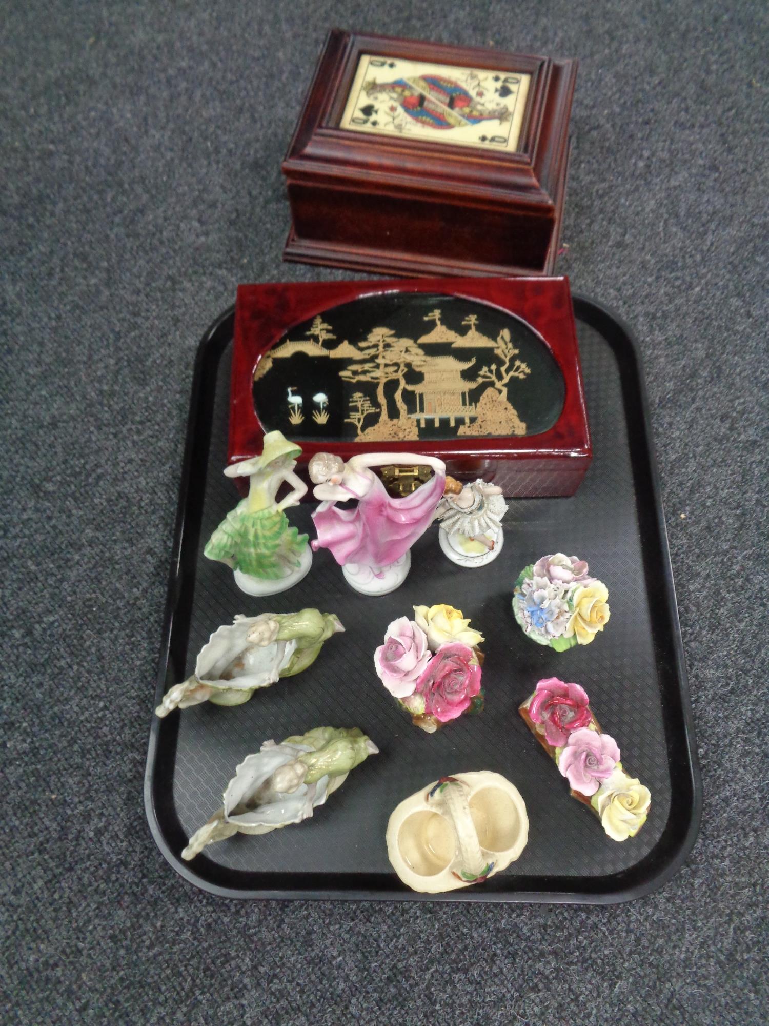 A tray of jewellery boxes, china flower posies,