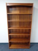 A 1970s teak open bookcase.