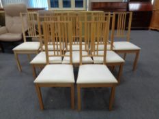 A set of ten contemporary oak rail backed dining chairs