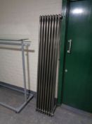 A Victorian style eight bar radiator, length 180 cm.