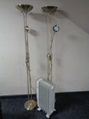 A Micromark oil filled radiator together with two brass effect floor lamps.