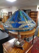 A Tiffany style table lamp with leaded glass shade depicting dragonflies