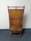 An Edwardian oak drop leaf occasional table together with a two tier folding cake stand