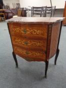 A reproduction French inlaid three drawer marble topped serpentine fronted chest with gilt metal