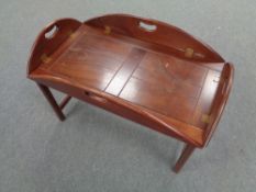 A rectangular mahogany butler's tray on stand