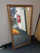 A gilt framed mirror.