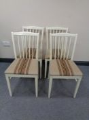 A set of six painted rail backed dining chairs with beige striped seats