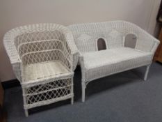 A wicker two seater settee together with an armchair