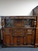 A carved oak buffet back sideboard