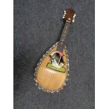 A bowl back mother of pearl inlaid mandolin