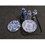A tray containing three Chinese blue and white vases together with two antique blue and white