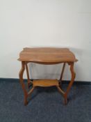 A shaped Edwardian oak occasional table