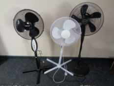 Three floor standing fans.