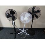 Three floor standing fans.