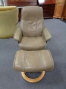 A Stressless leather swivel adjustable armchair with matching stool