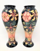 A pair of William John Moorcroft vases, height 27cm.