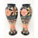 A pair of William John Moorcroft vases, height 27cm.