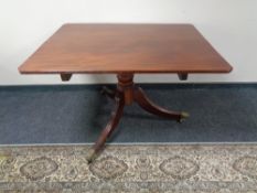 A Victorian mahogany tilt top tea table on three-way pedestal