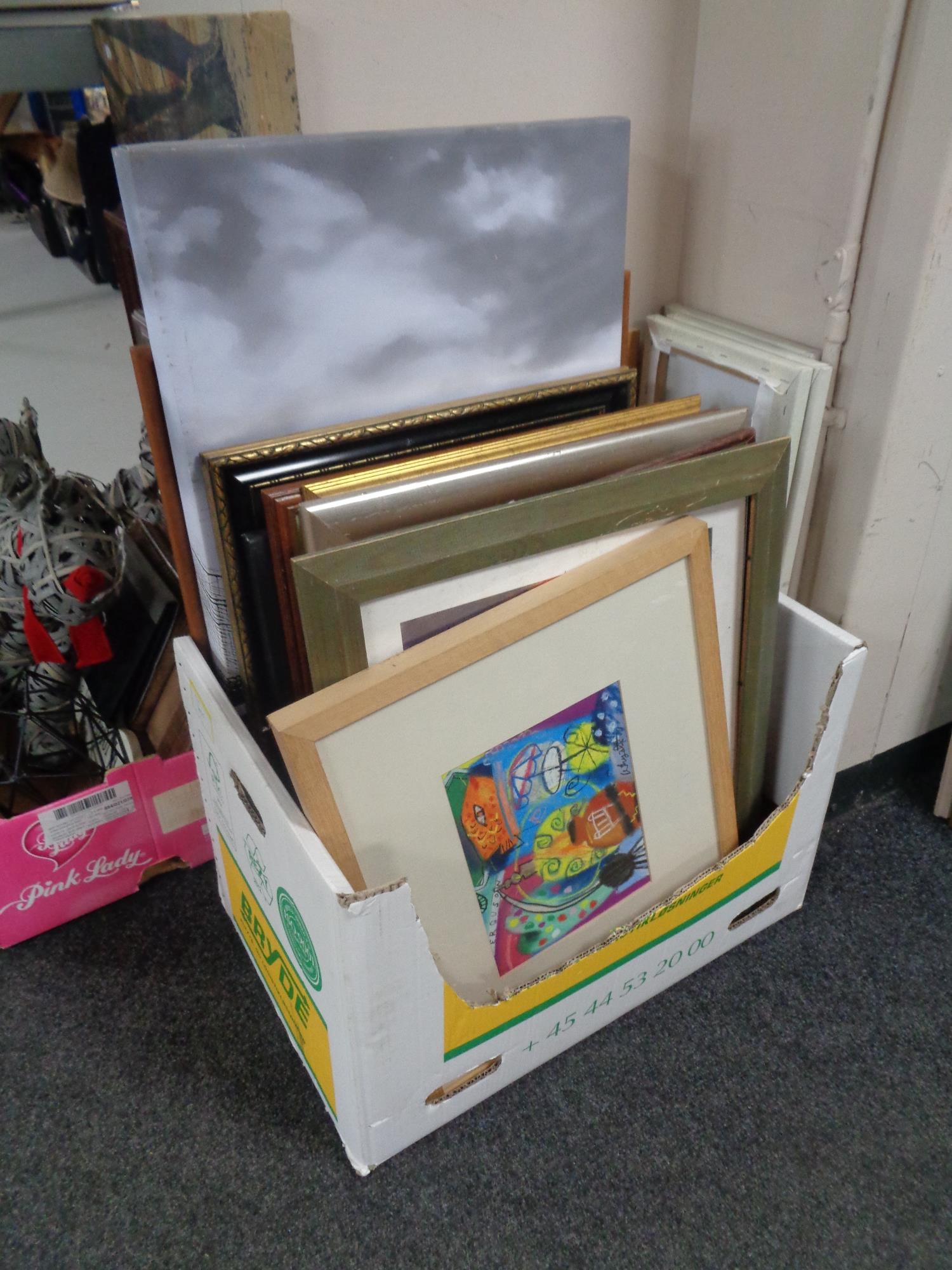 A box of a large quantity of assorted framed prints and wall canvases,