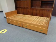 A pine 3' bed framed fitted with two drawers beneath
