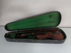 An early twentieth century violin and bow in coffin case CONDITION REPORT: Back 14".