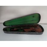 An early twentieth century violin and bow in coffin case CONDITION REPORT: Back 14".