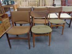 A pair of mid century Danish teak dining chairs together with a further set of three Danish teak