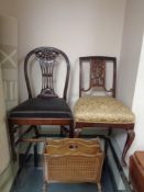 Two antique mahogany dining chairs together with a bergere sided magazine rack.