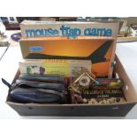 A box of vintage board games, Mouse Trap, Lord of the Rings box set,