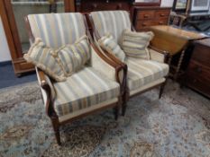 A pair of Wade Victorian style armchairs upholstered in a striped fabric