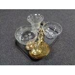 A tray containing cut glass lead crystal fruit bowls and vases together with antique brass horse