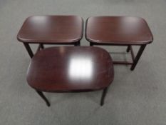 Three occasional tables in mahogany finish