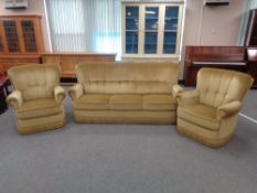 A mid century three piece green dralon lounge suite