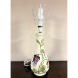 A Moorcroft table lamp on cream ground, height 40cm excluding bulb.