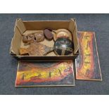 A box of tribal wall masks, bellows,