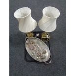 A silver plated twin handled try containing cake slices and tongs,