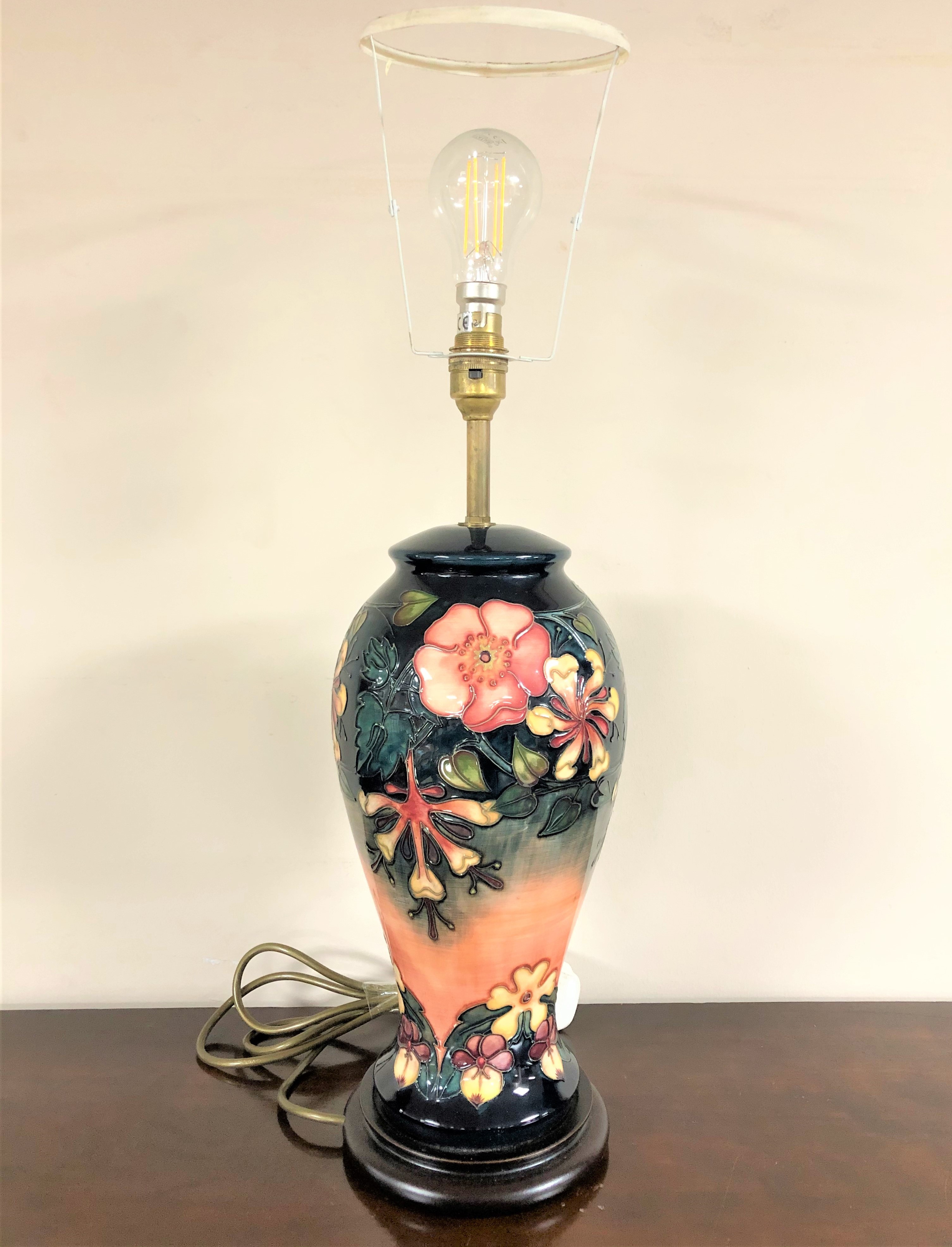 A William John Moorcroft pottery table lamp, height 45cm excluding bulb.