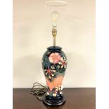 A William John Moorcroft pottery table lamp, height 45cm excluding bulb.