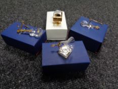 Four boxed Swarovski crystal ornaments to include guitar on stand, violin on stand,