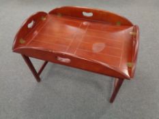 A rectangular mahogany butler's tray on stand